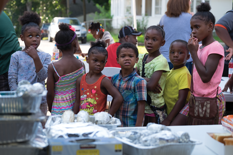 Youngsters gather in a waiting area at a health screening event sponsored by the Coordinated Health Impact Alliance at Grand Rapids’ Hillcrest Baptist Church on Aug. 31, 2016.