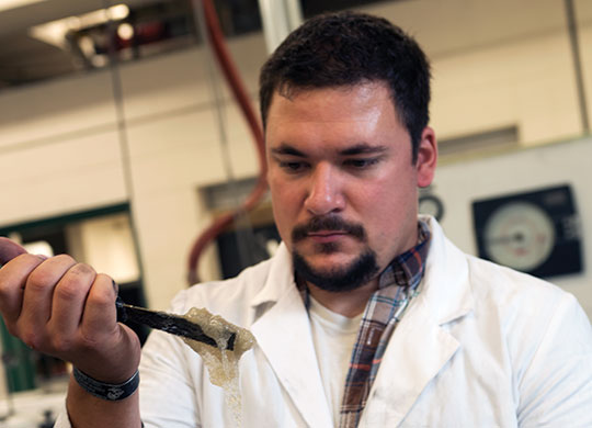 2017 Student Research Fellowship student participant Jeffery Dickerson in plastics engineering lab.
