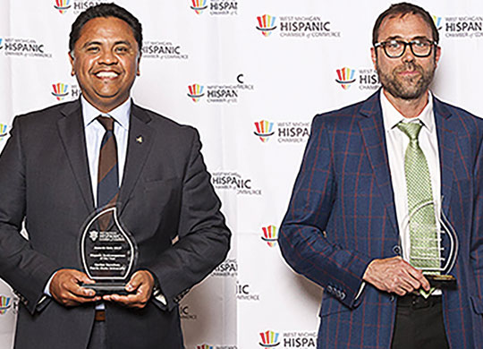 Latino Business and Economic Development Center Director Carlos Sanchez (left)and Director of Community Engagement Tony Baker (right) were honored April 19, 2017. Photos courtesy of the West Michigan Hispanic Chamber of Commerce.